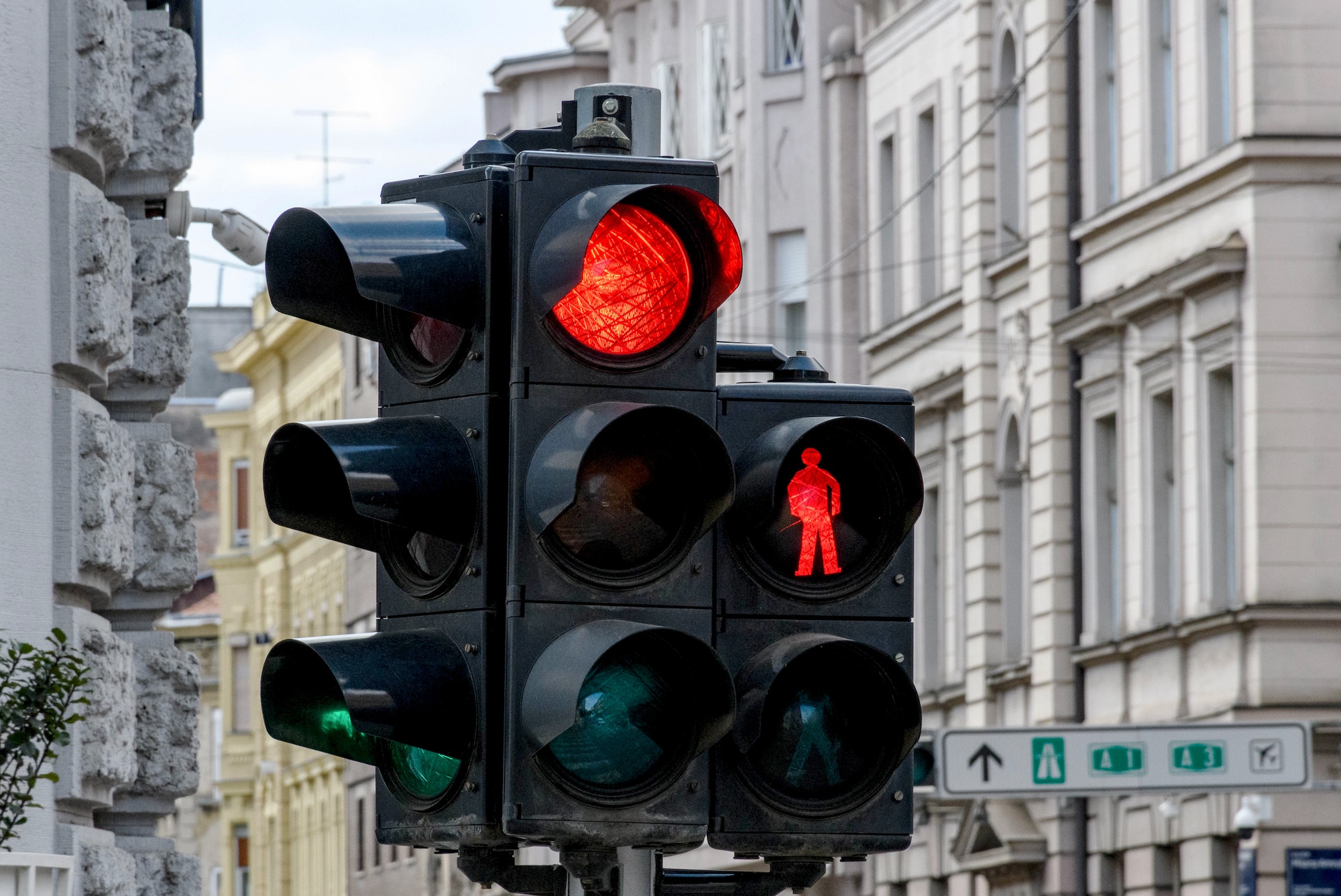 Close-up of traffic light in city. Red light at an intersection. J. U. Passion - Realtor, Writer, Preacher, Teacher