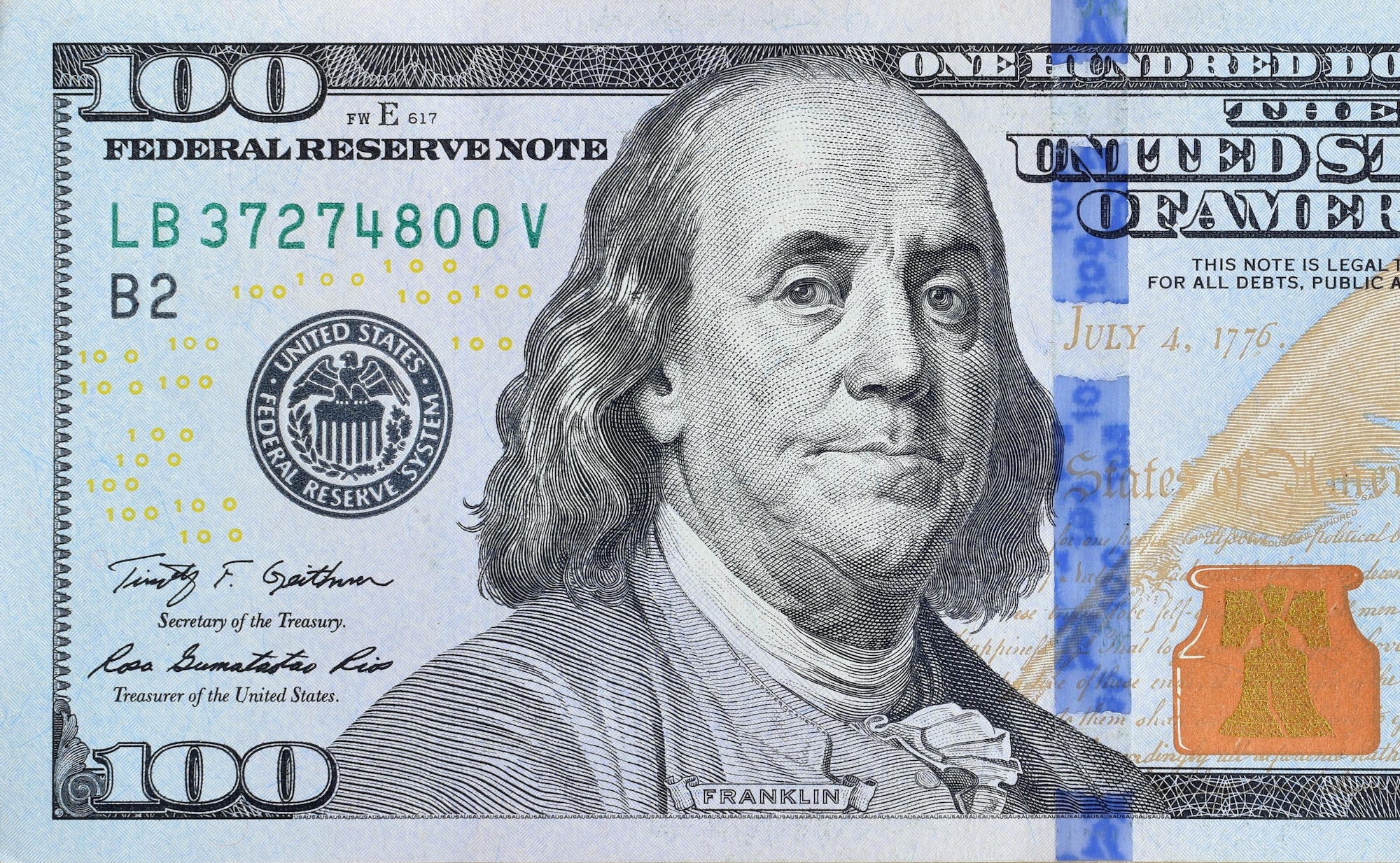 Portrait of US president Benjamin Franklin on 100 dollars banknote closeup macro fragment